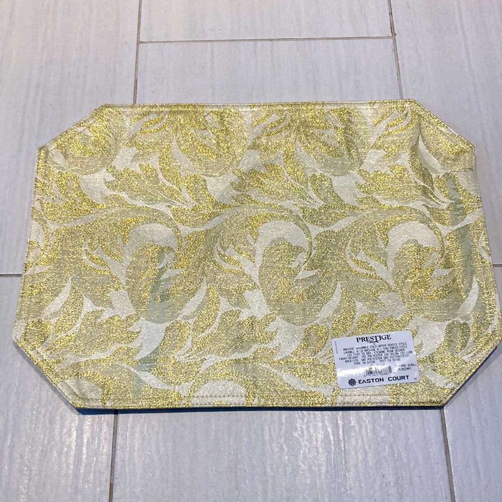 Brand new set of 4 gold jacquard scroll placemats